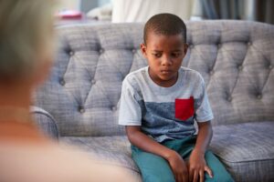 A parent comforting and supporting a child, illustrating how to take care of your child's mental health