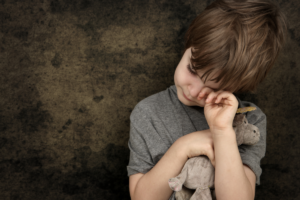 A child displaying OCD symptoms, crying and distressed