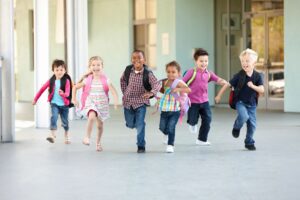 Children running and feeling happy - signs of depression and finding help