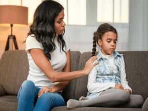 Mother comforting child experiencing anxiety symptoms