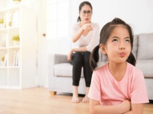 A mother guiding her child, showcasing ways to address and help your misbehaving child