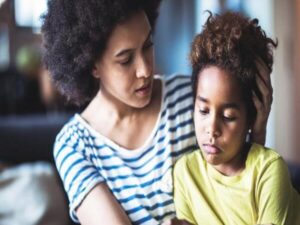 Parent comforting child, representing what parents need to know about childhood depression