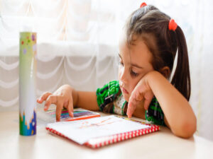 A child sitting alone with a sad expression, illustrating the need to recognize signs of despondency in children